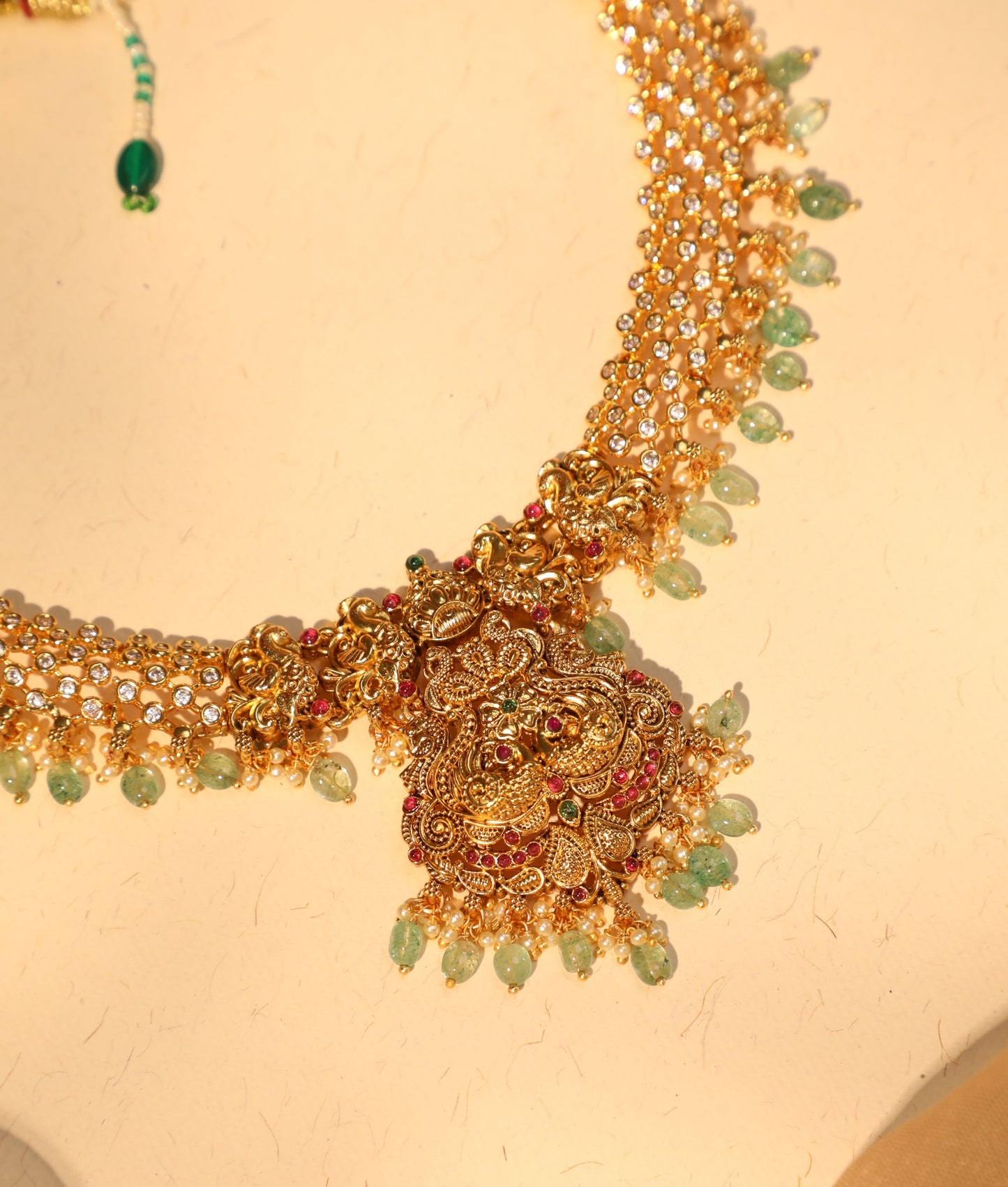 Antique Gold Finish Peacock Necklace Set with AD Stone Detailing and Matching Earrings | NC038